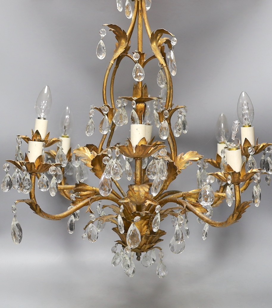 A French gilt metal and cut glass drop eight branch, electrolier, 58 cms high.
